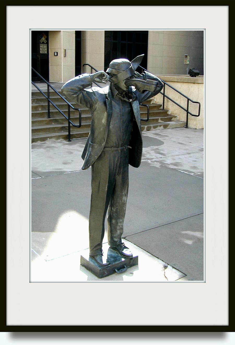 Terry Allen (b. 1943  in Wichita, Kansas). Modern Communication. 1995. Bronze. Commissioned by the Municipal Art Commision’s One-Percent-For-Art Program of Kansas City. Located 1111 Locust Street, New Communication Plaza (outside the Kansas City Police Department communications building),  in Downtown,Kansas City,Missouri,US. http://www.flickr.com/photos/chimphappyhour/1186411804/