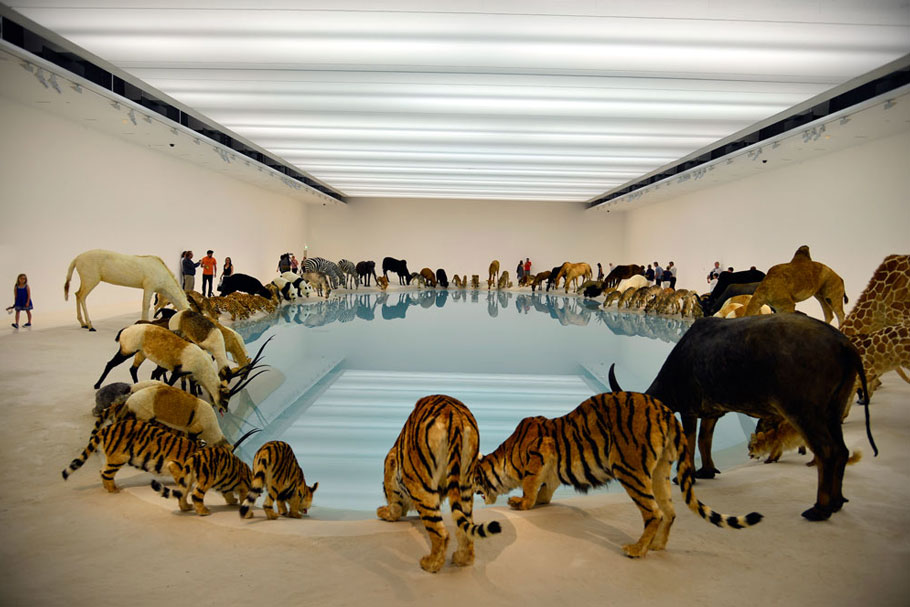 Cai Guo-Qiang (b. 1957 in Quanzhou City, Fujian Province, China. Lives and works in in New York since 1995). Heritage. Exhibition at Brisbane’s Gallery of Modern Art which ran from November 2013 to May 2014. 99 life-sized replicas of animals, water, sand, drip mechanism. Polystyrene casts covered in fur made from goatskin.