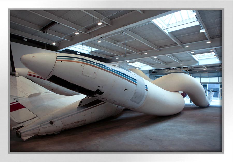 Adel Abdessemed (b. 1971 in Constatine, Algeria. Lives and works in Paris, France). Telle mère tel fils. 2008. Installation view of the 2009 solo exhibition Adel Abdessemed: RIO at David Zwirner, New York. Airplanes, felt, aluminum, metal. 27×4×5 meters.