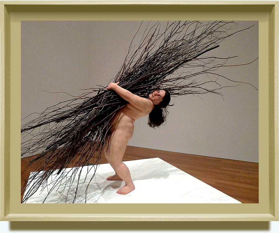 Ron Mueck (b.  1958 in Melbourne, Australia;  based in London). Woman with sticks. 2008. Silicone, polyurethane, steel, wood, synthetic hair. 170.0×183.0×120.0 cm. Private collection. Image courtesy of  Anthony d’Offay, London.