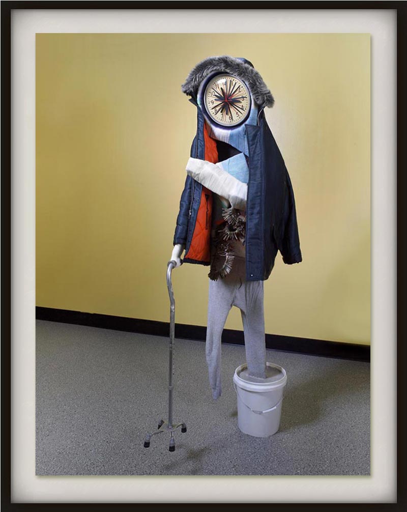 Ryan Johnson (b. 1978  in Karachi, Pakistan). Watchman. 2008. Casting tape, glass, plywood, cement, plastic, cardboard, spray paint, enamel paint, aluminium, keys, fabric, rubber. 213.4×91.4×55.9 cm. http://www.saatchi-gallery.co.uk/artists/artpages/ryan_johnson_watchman.htm