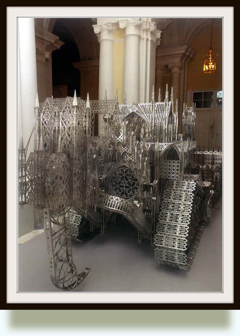 Wim Delvoye (b. 1965 in Wervik, West Flanders, Belgium). D11 (rear side). 2009. Stainless steel, laser carving. 450×190×184 cm. Installation view at the State Hermitage Museum, St. Petersburg. The Caterpillar D11 is a large bulldozer, manufactured by Caterpillar Inc. in East Peoria, Illinois, and mainly used in the mining industry. Primarily designed as a bulldozer, it also used for push-loading scrapers, and ripping rock overburden.