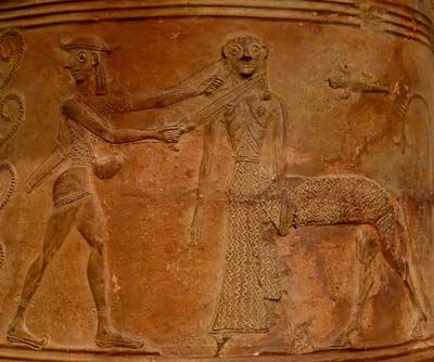 Perseus (left, wearing a hat, winged boots and the kibisis slung over his shoulder) averts his gaze as he kills Medusa, figured here as a female centaur. Detail from an orientalizing relief pithos. Terracotta with stamped and cut decoration, Cycladic artwork, ca. 660 BC. From Thebes, Boeotia. Musée du Louvre, Paris, France.