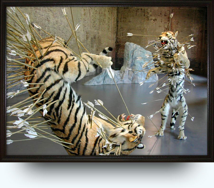 Cai Guo-Qiang (b. 1957 in Quanzhou City, Fujian Province, China. Lives and works in in New York since 1995). Inopportune: Stage Two. 2004. Tigers: paper mache, plaster, fiber glass, resin, painted hide. Arrows: brass, bamboo, feathers. Stage prop: styrofoam, wood, canvas, acrylic paint. Installation view: “Cai Guo-Qiang: Inopportune”, MASS MoCA, North Adams, MA, US. Collection of the artist.